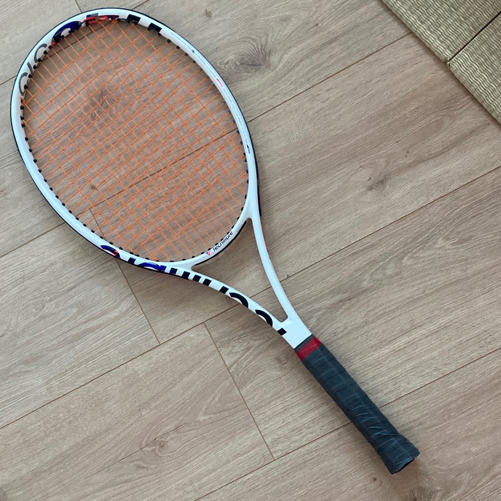 White and Orange Tennis Racket
